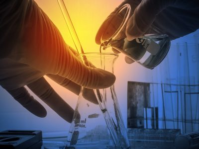 science laboratory test tubes with periodic table background