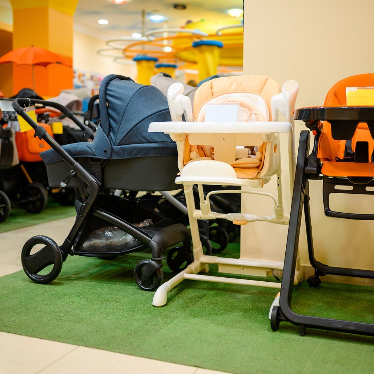 Baby strollers assortment in children's store. Showcase with perambulator variety in kid's shop, child transportation department, nobody